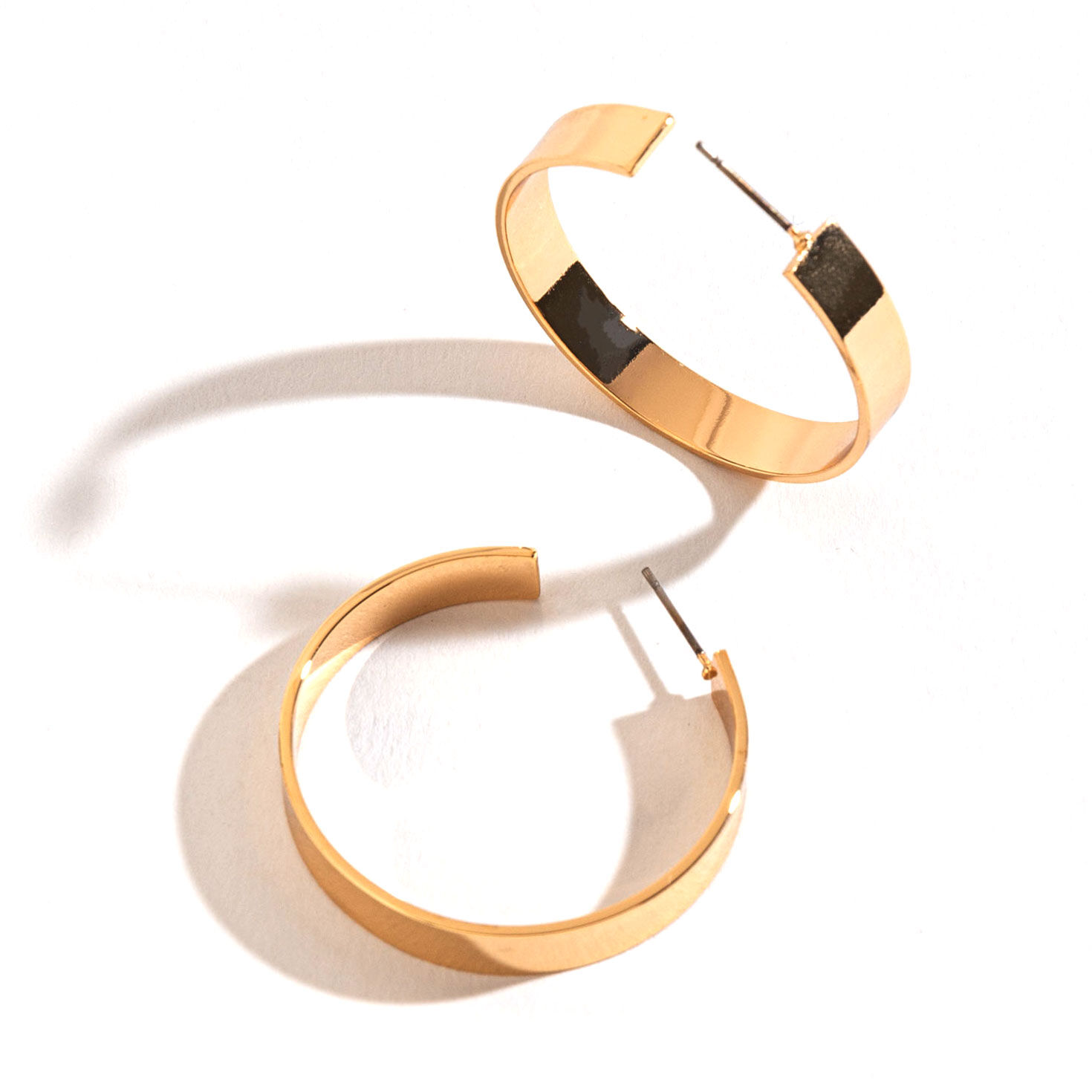 Howard's Jewelry Large Flat Gold Hoop Earrings